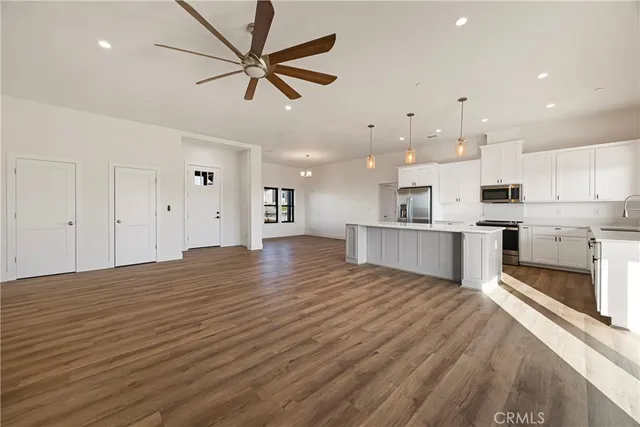 a view of kitchen with wooden floor and window