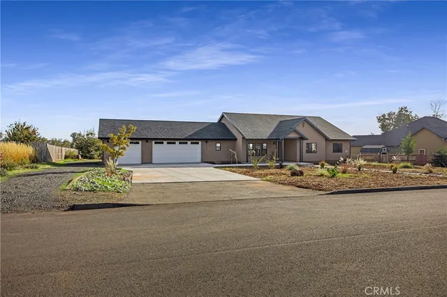 a view of houses with a street