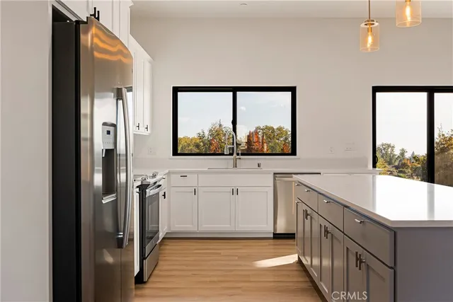 a view of a kitchen from the entryway