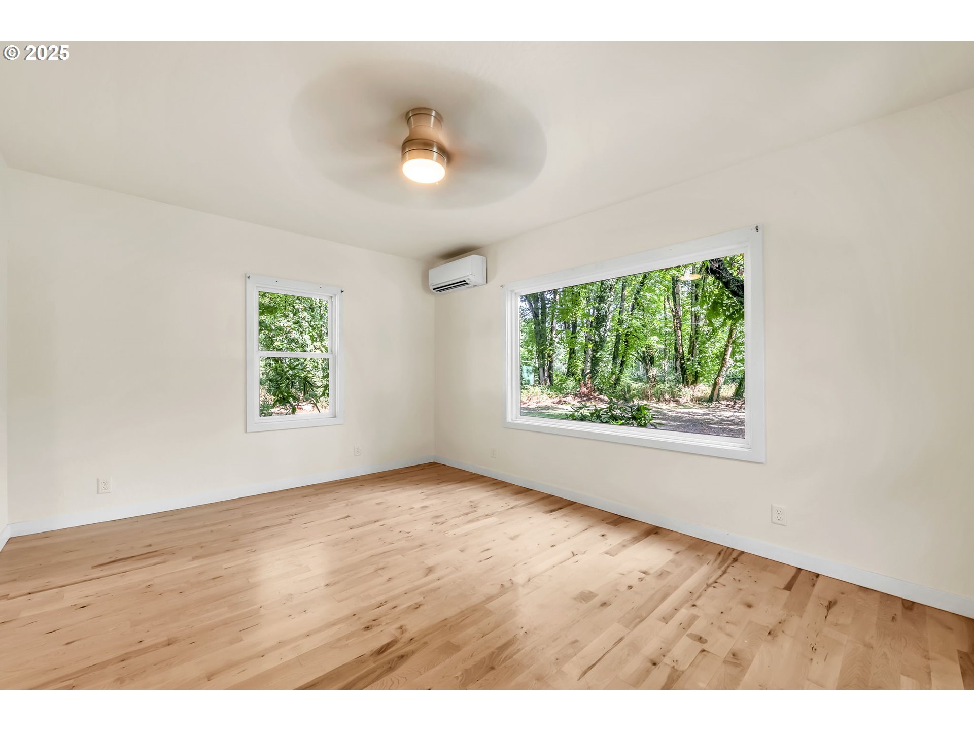 38286 Camp Creek Road Springfield, OR 97478 - Photo 15 of 48 an empty room with wooden floor and windows
