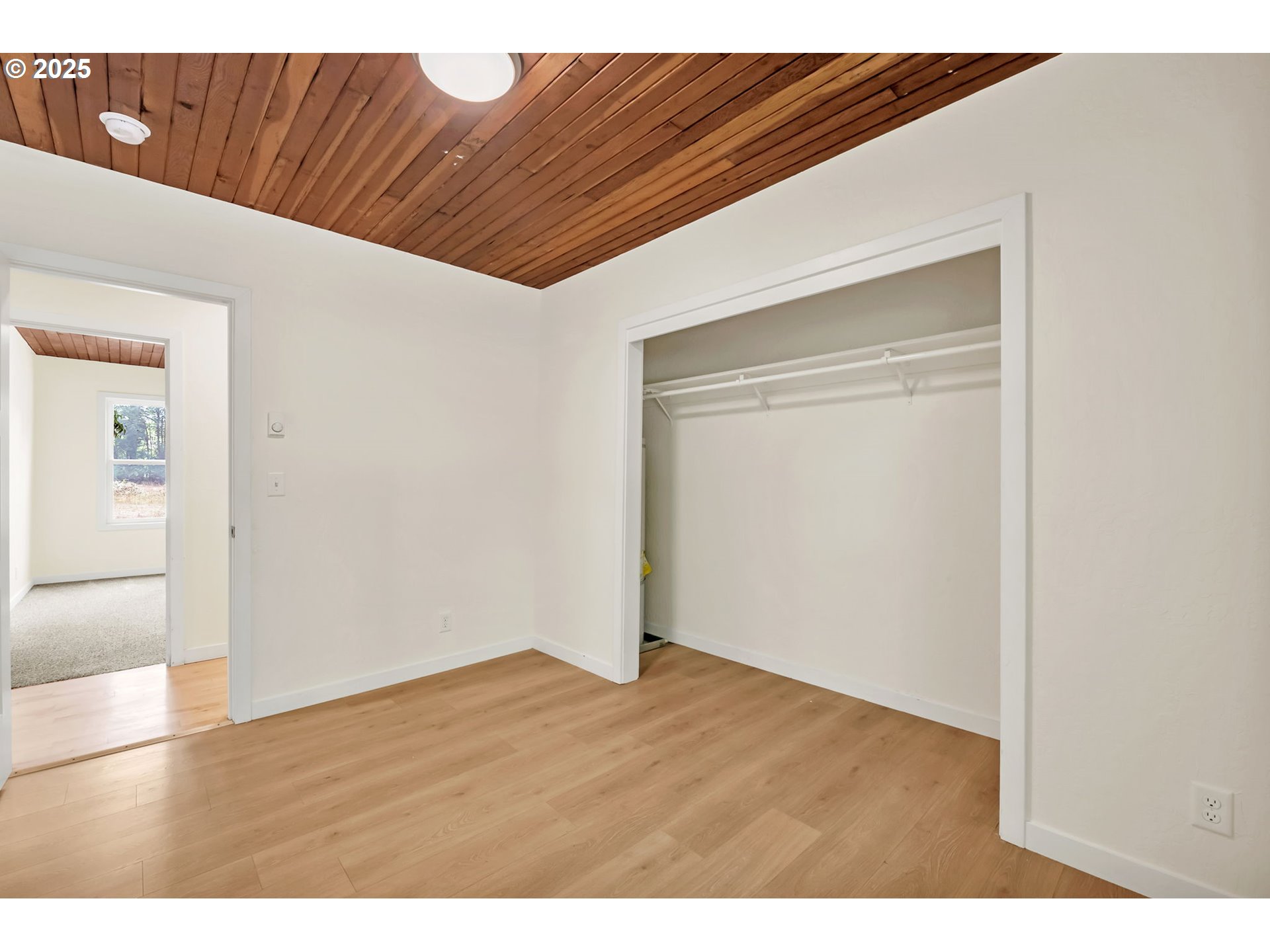 38286 Camp Creek Road Springfield, OR 97478 - Photo 19 of 48 a view of an empty room with wooden floor