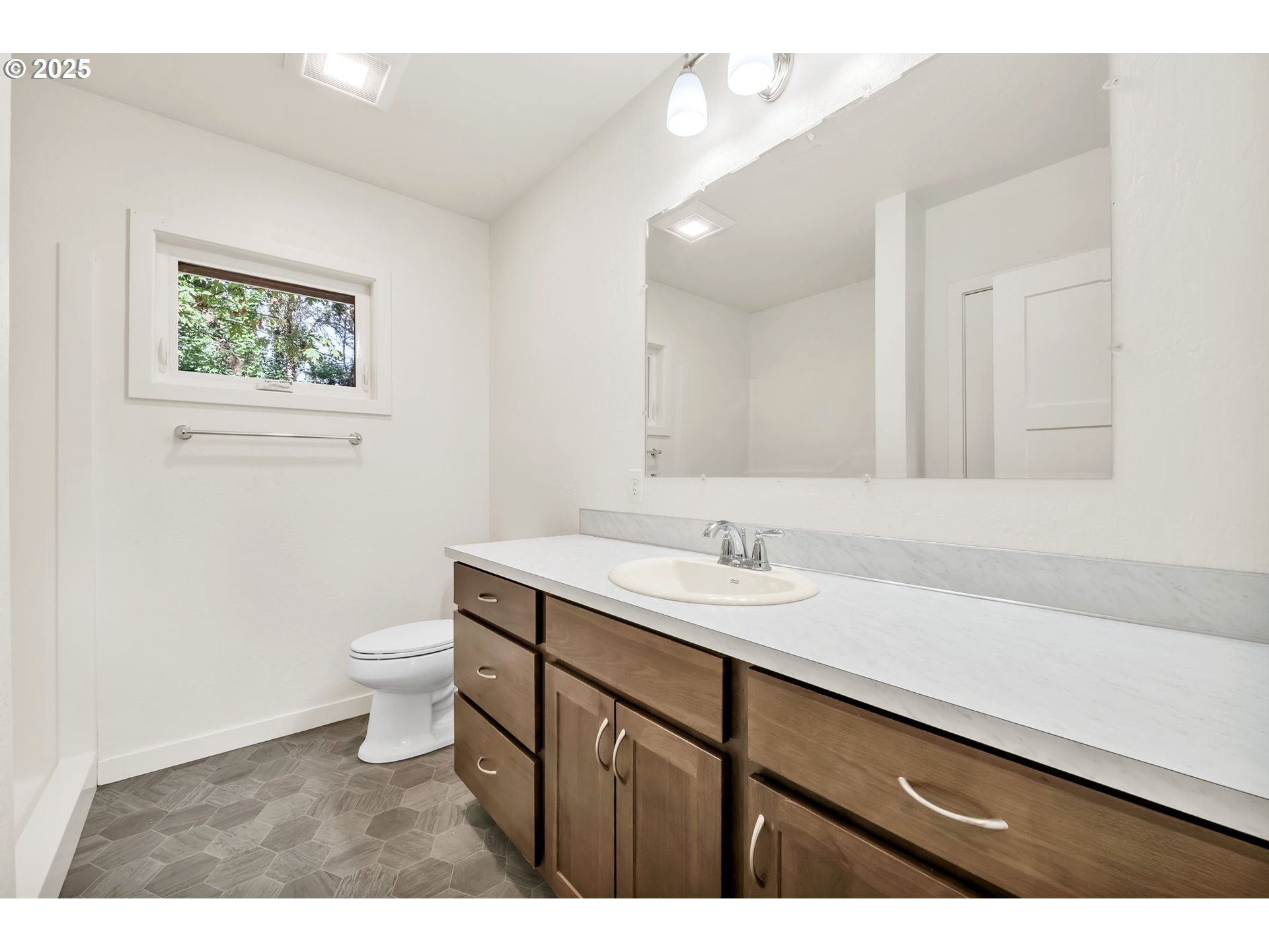 38286 Camp Creek Road Springfield, OR 97478 - Photo 25 of 48 a bathroom with a sink a toilet and a mirror