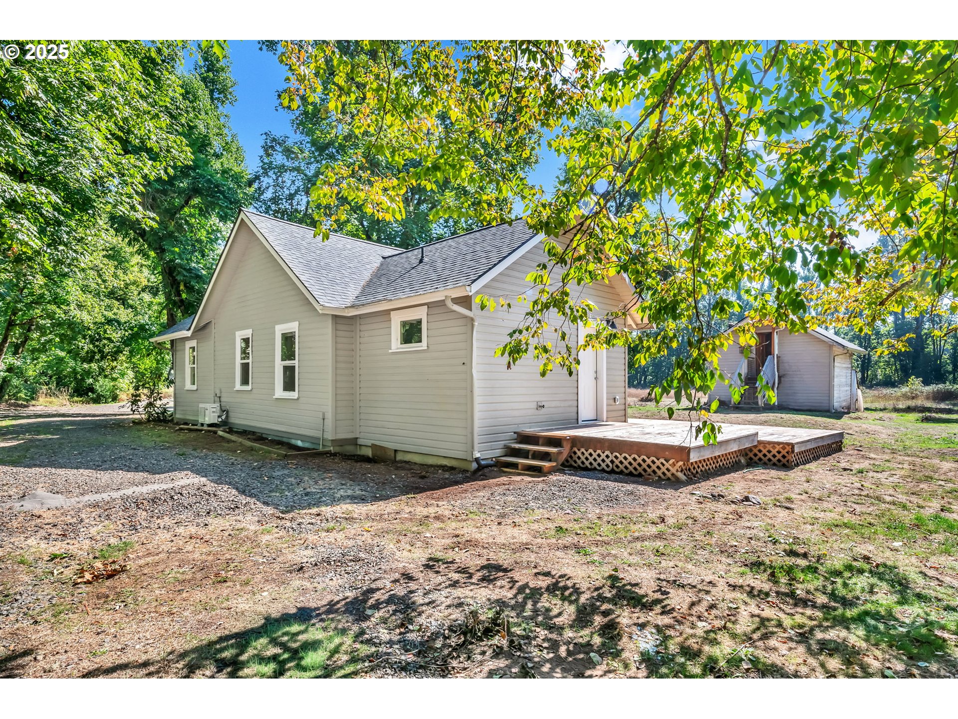 38286 Camp Creek Road Springfield, OR 97478 - Photo 28 of 48 a view of a backyard with a garden and trees