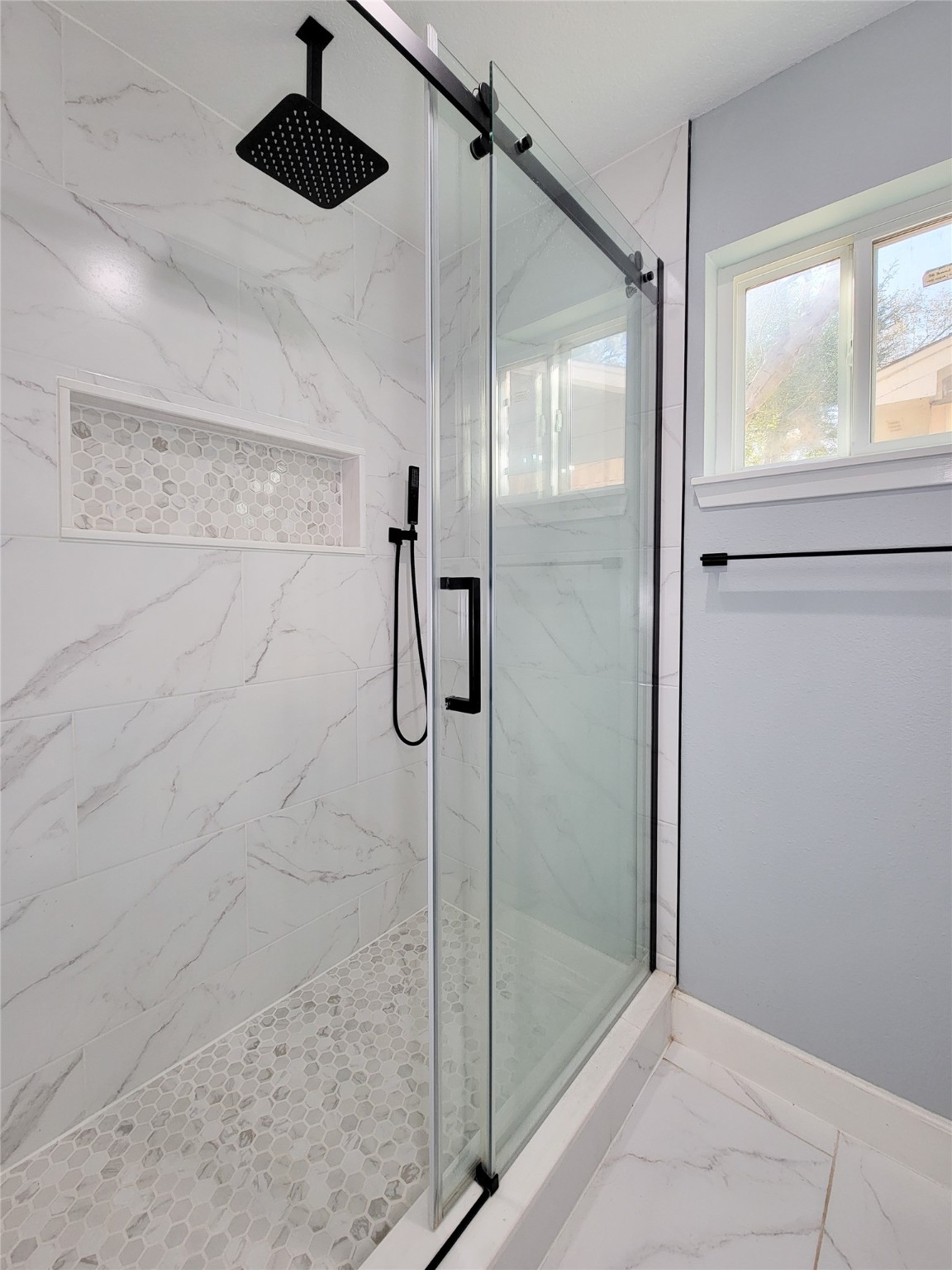 3434 Almondwood Drive Spring, TX 77389 - Photo 20 of 37 a bathroom with a shower and a glass door