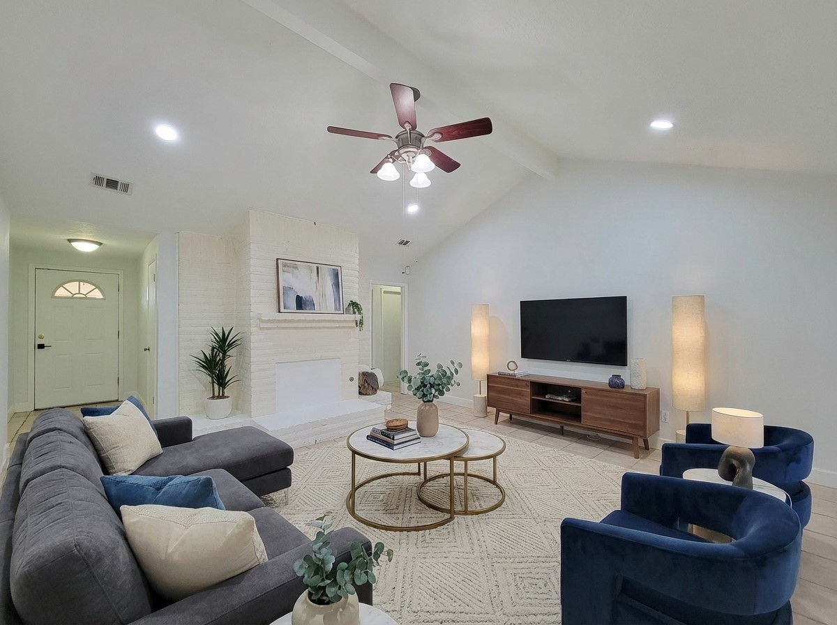 3434 Almondwood Drive Spring, TX 77389 - Photo 2 of 37 a living room with furniture and a flat screen tv