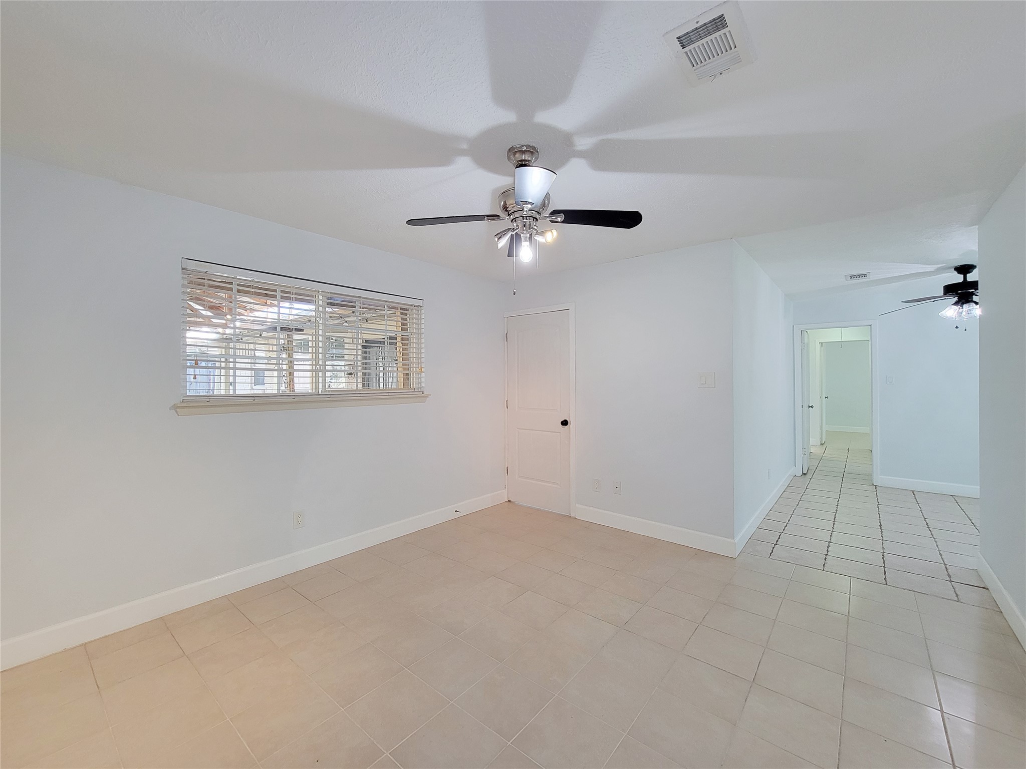 3434 Almondwood Drive Spring, TX 77389 - Photo 23 of 37 wooden floor in an empty room with a window