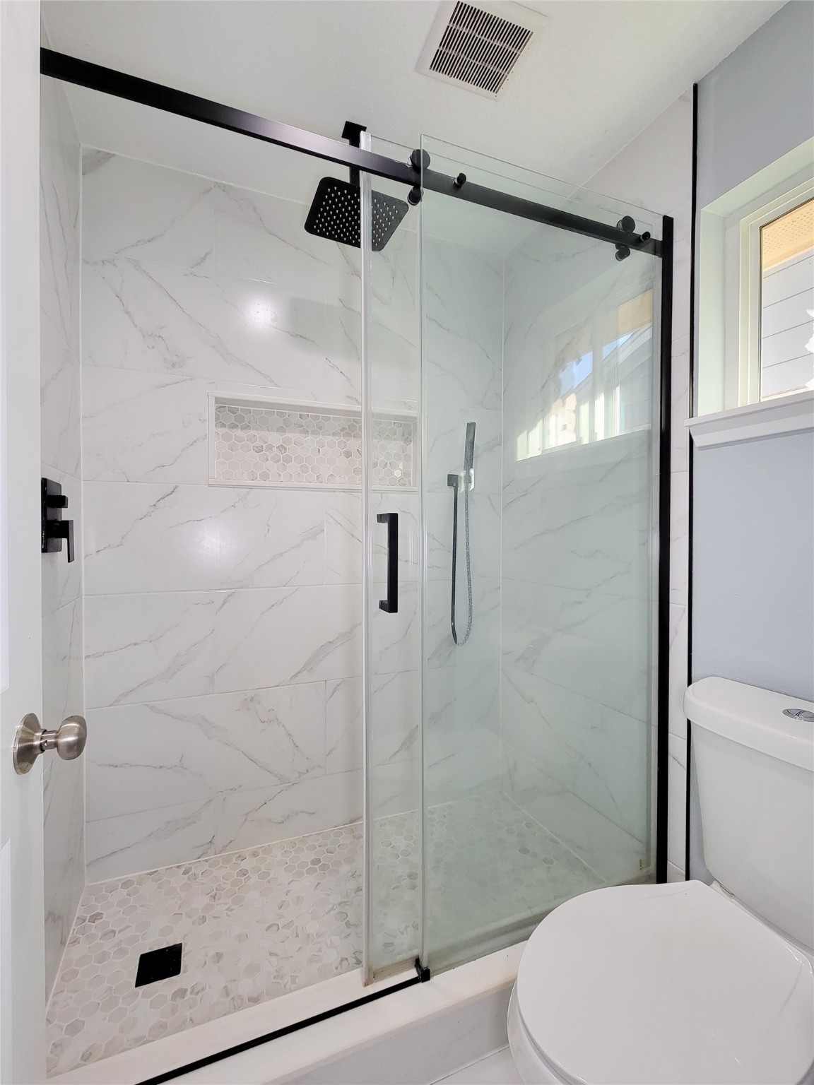 3434 Almondwood Drive Spring, TX 77389 - Photo 27 of 37 a bathroom that has a glass shower door