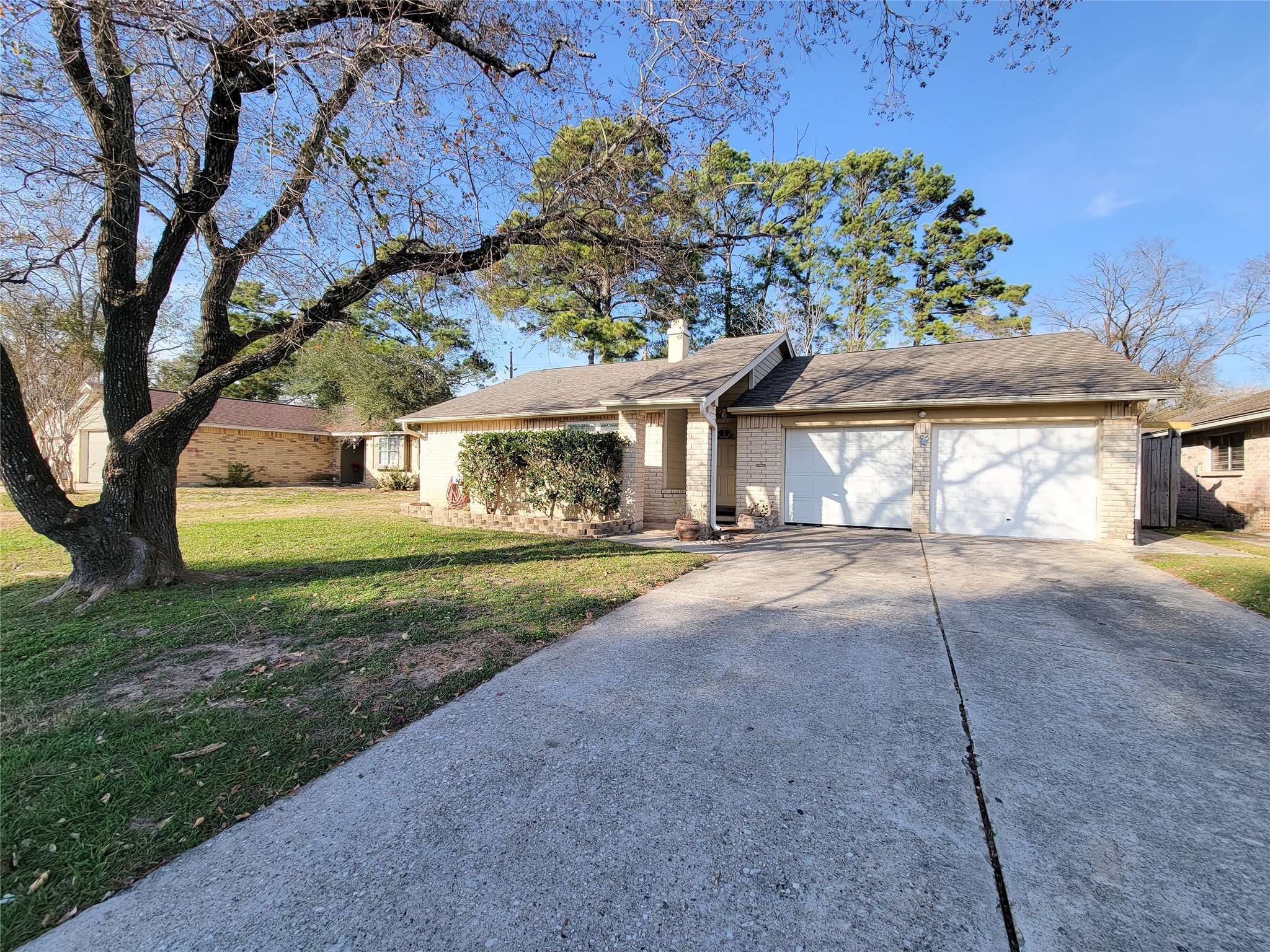 3434 Almondwood Drive Spring, TX 77389 - Photo 37 of 37 a front view of a house with a yard and garage