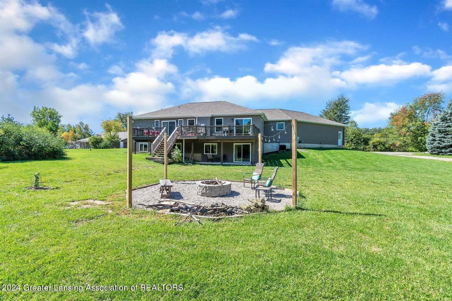 2596 Tomlinson Road Mason, MI 48854 - Photo 24 of 28 Spacious Backyard
