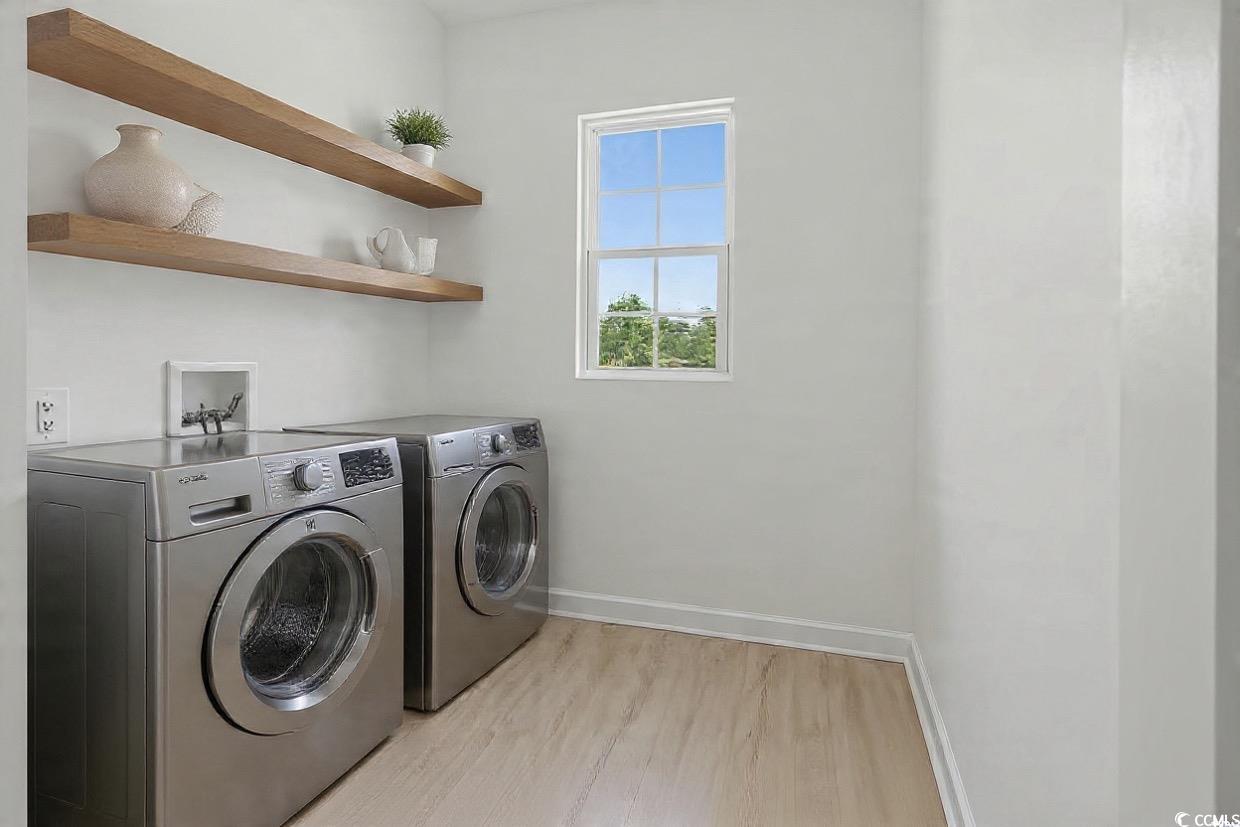 232 Ole Maple Street Loris, SC 29569 - Photo 15 of 39 Laundry room with light wood finished floors and washing machine and clothes dryer