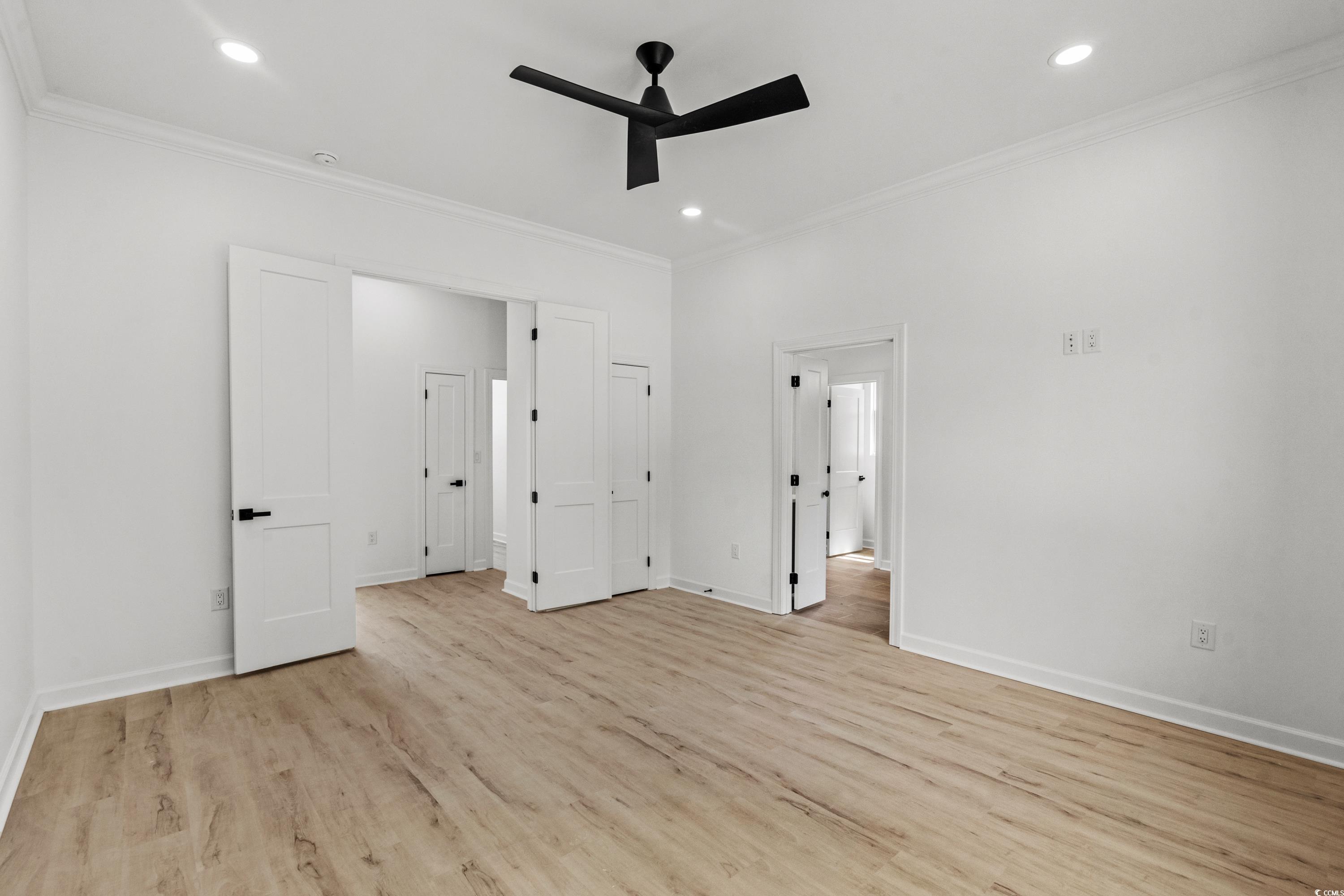 232 Ole Maple Street Loris, SC 29569 - Photo 23 of 40 Unfurnished bedroom featuring ornamental molding, light wood-type flooring, ceiling fan, and recessed lighting