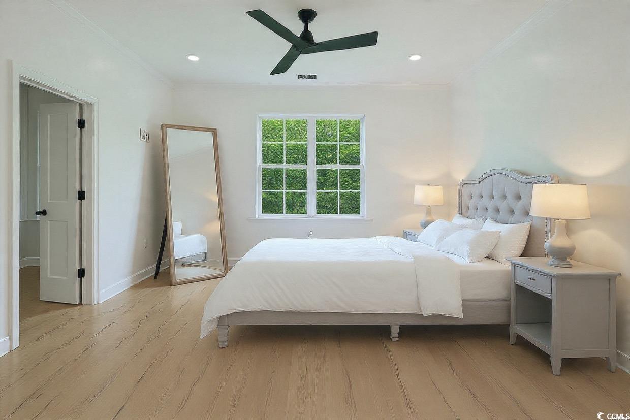 232 Ole Maple Street Loris, SC 29569 - Photo 23 of 39 Bedroom with crown molding, a ceiling fan, light wood-style floors, and recessed lighting