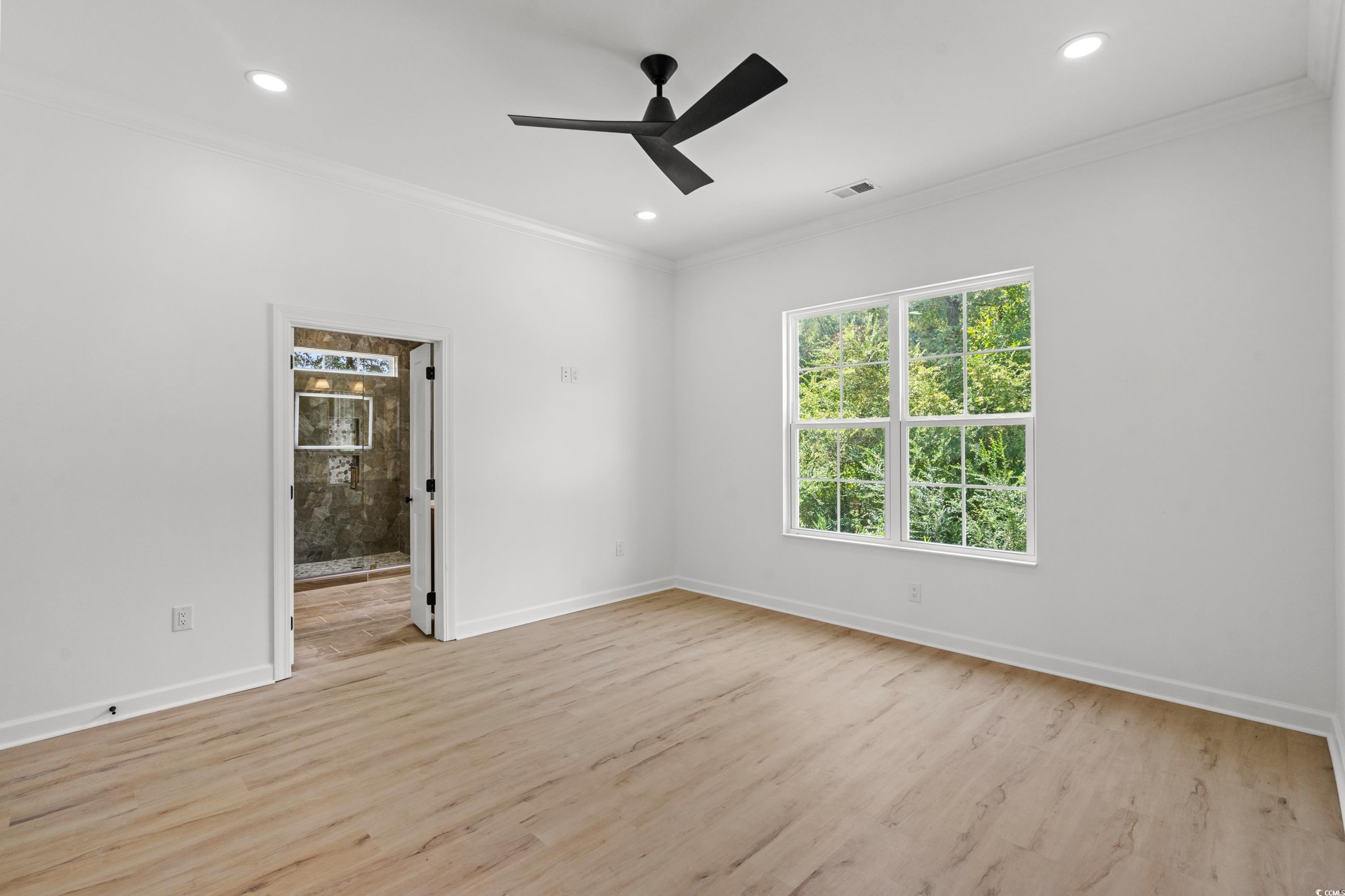 232 Ole Maple Street Loris, SC 29569 - Photo 25 of 39 Unfurnished room with ornamental molding, light wood-type flooring, ceiling fan, and recessed lighting