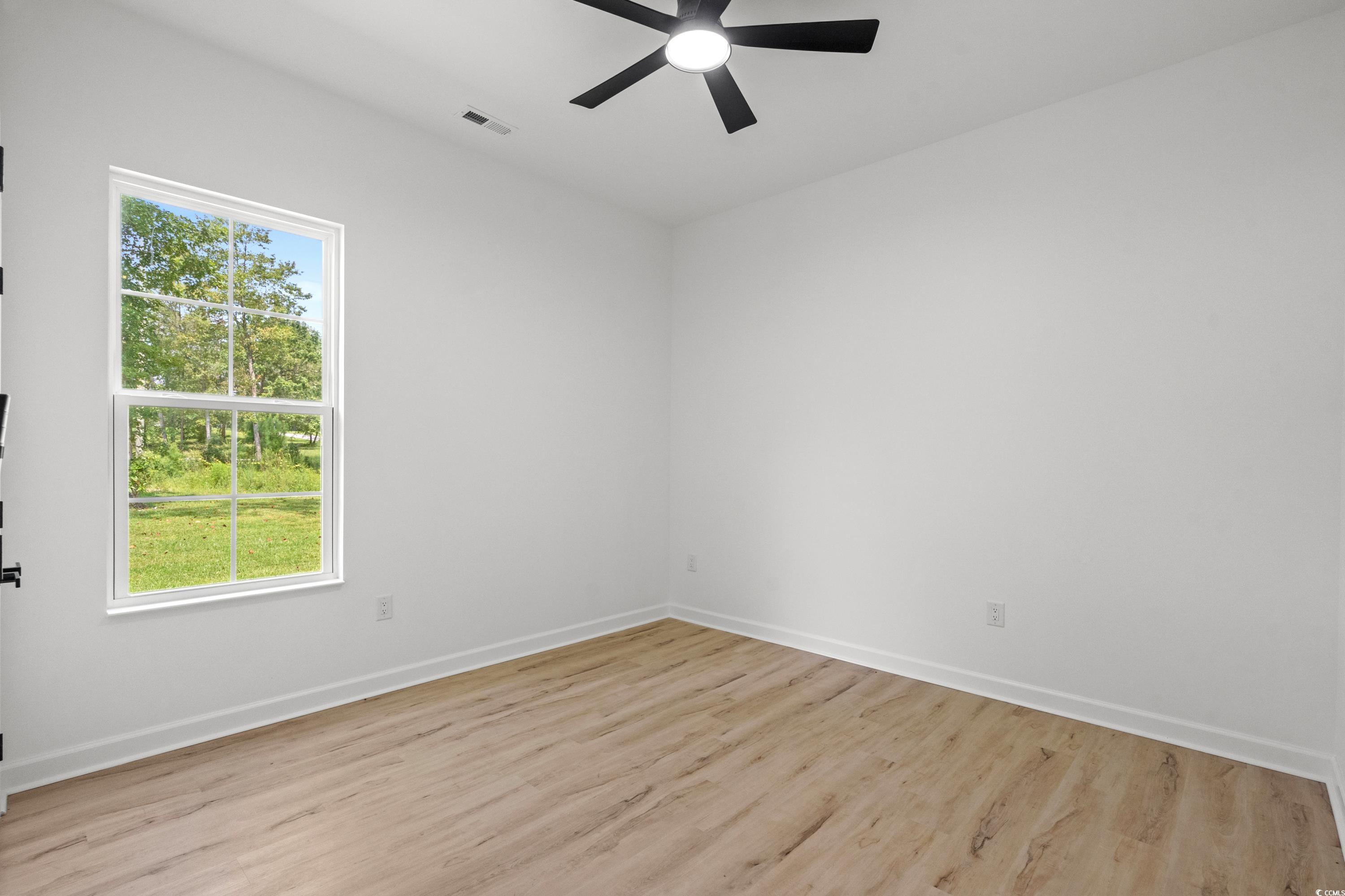 232 Ole Maple Street Loris, SC 29569 - Photo 31 of 40 Empty room featuring light wood-style flooring and ceiling fan