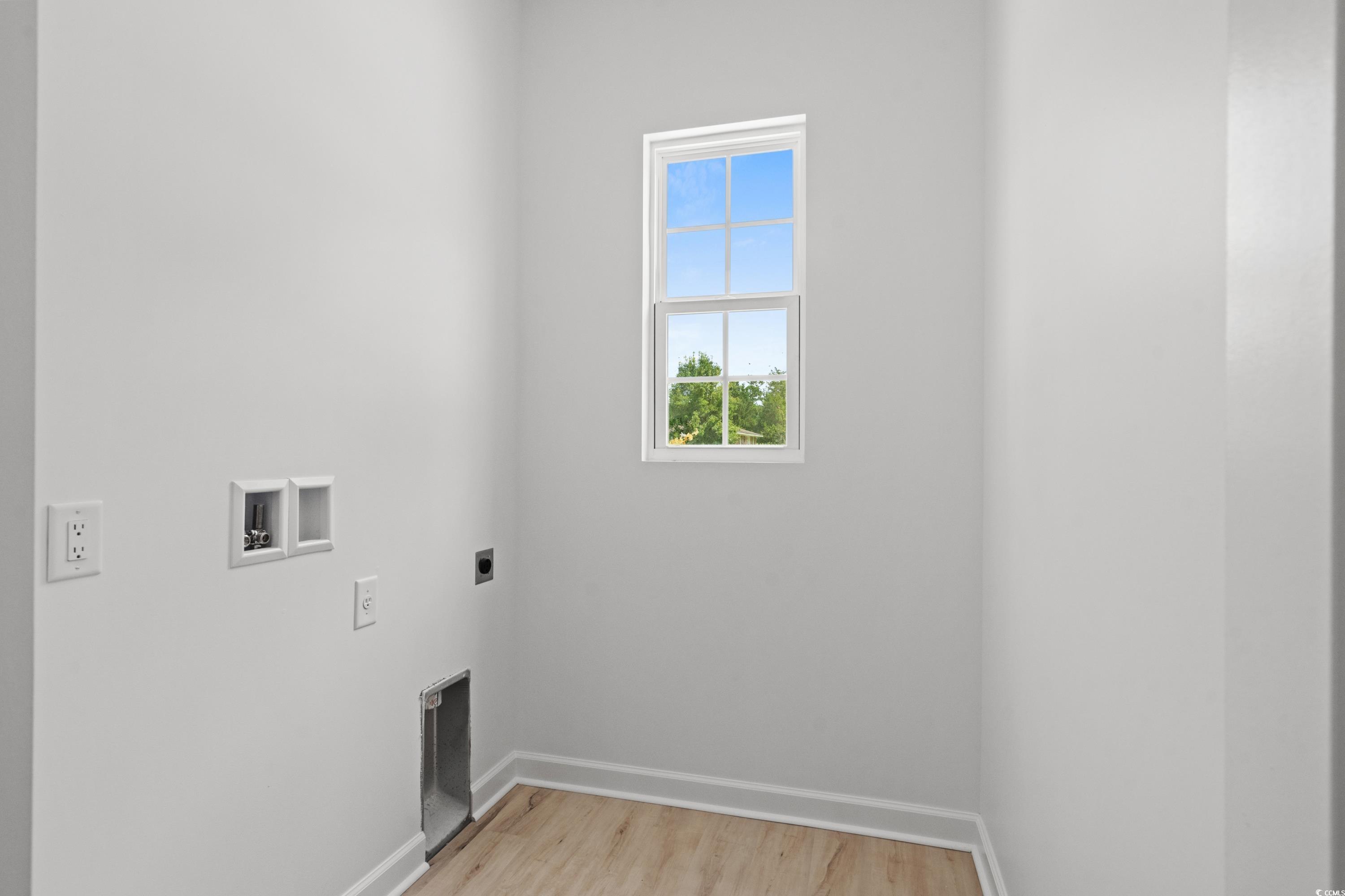 232 Ole Maple Street Loris, SC 29569 - Photo 33 of 40 Washroom featuring light wood-style floors, washer hookup, and hookup for an electric dryer