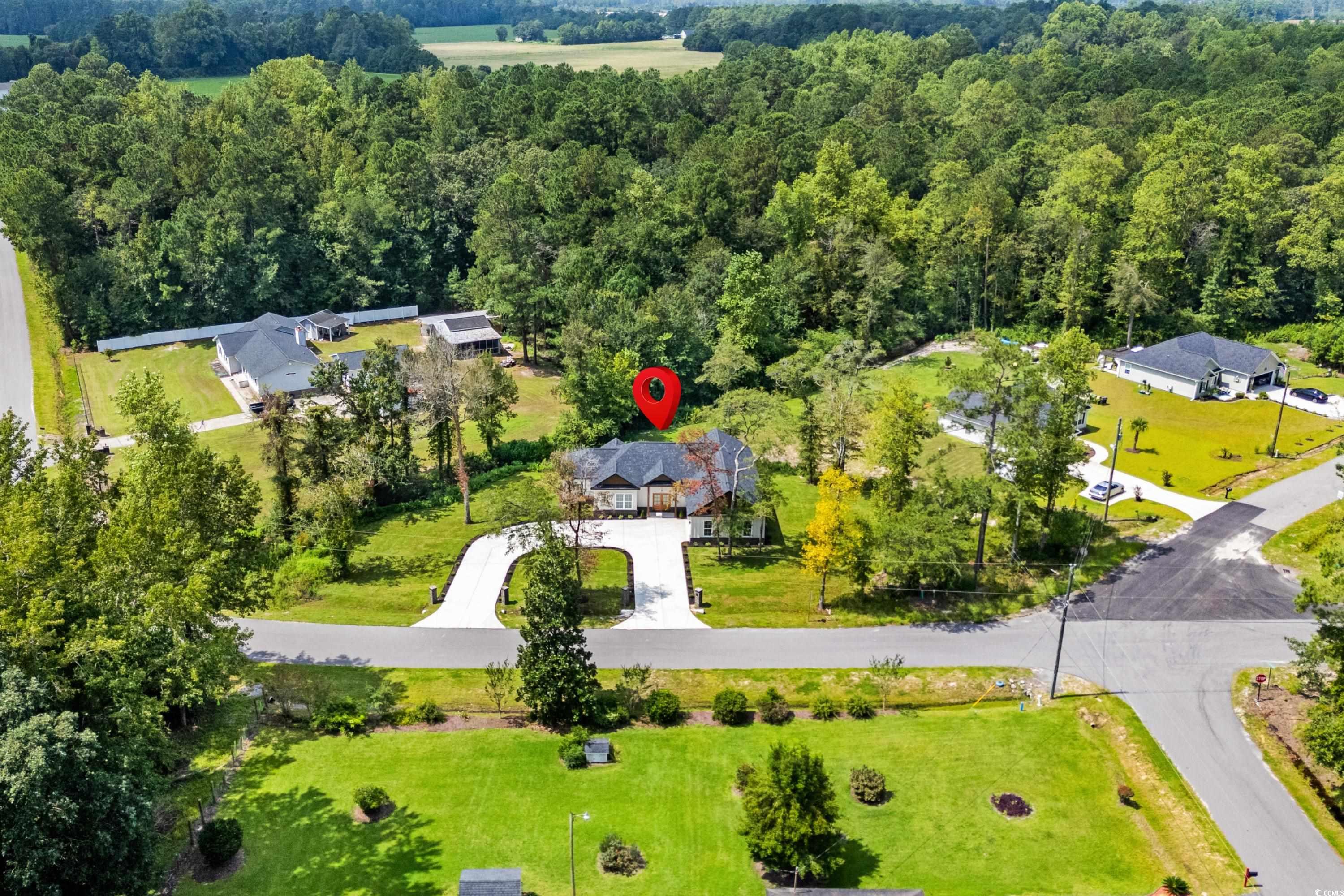 232 Ole Maple Street Loris, SC 29569 - Photo 35 of 39 Aerial view of property and surrounding area featuring a forest