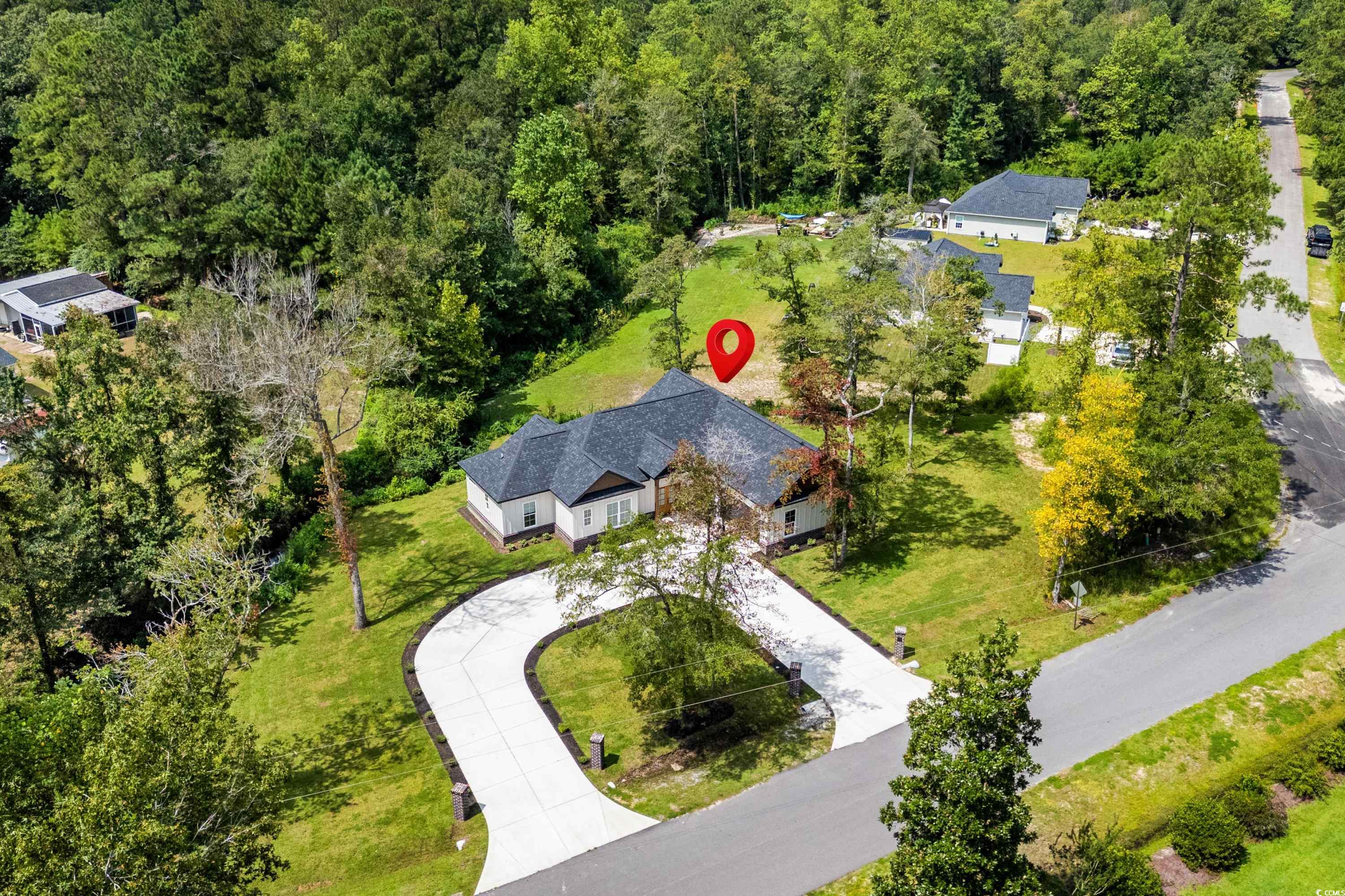 232 Ole Maple Street Loris, SC 29569 - Photo 35 of 40 Aerial view of property and surrounding area featuring a forest