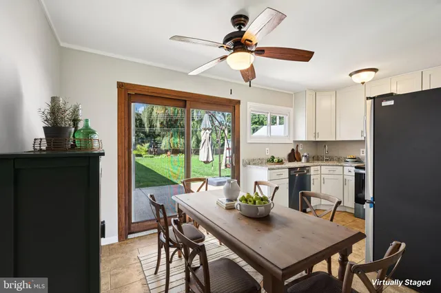 a view of a dining room with furniture window and outside view