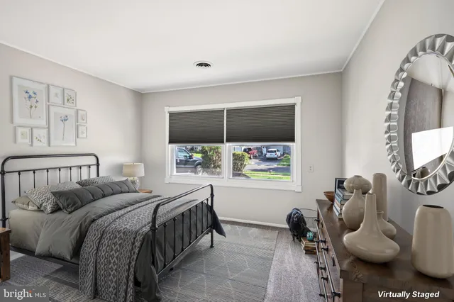 a bed room with furniture and a window