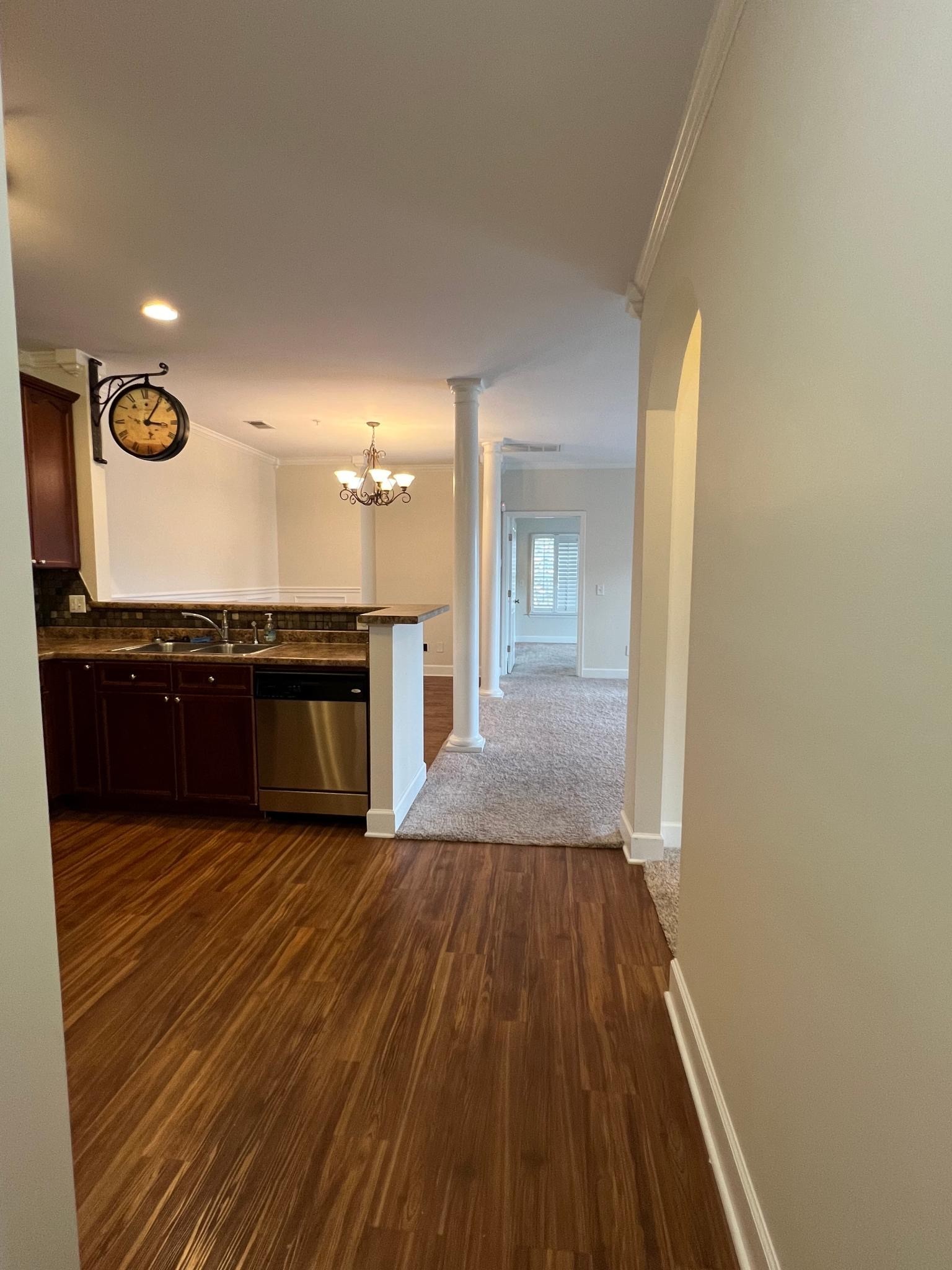 7230 Althorp Way, Unit W7 Nashville, TN 37211 - Photo 3 of 21 a view of a kitchen with wooden floor and a sink