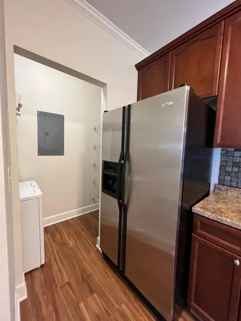 a kitchen with a refrigerator and a sink