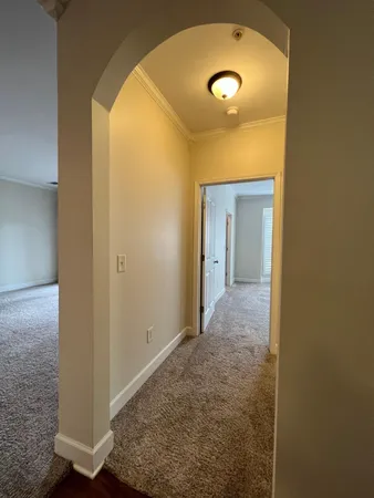 a bathroom with a sink and mirror with toilet