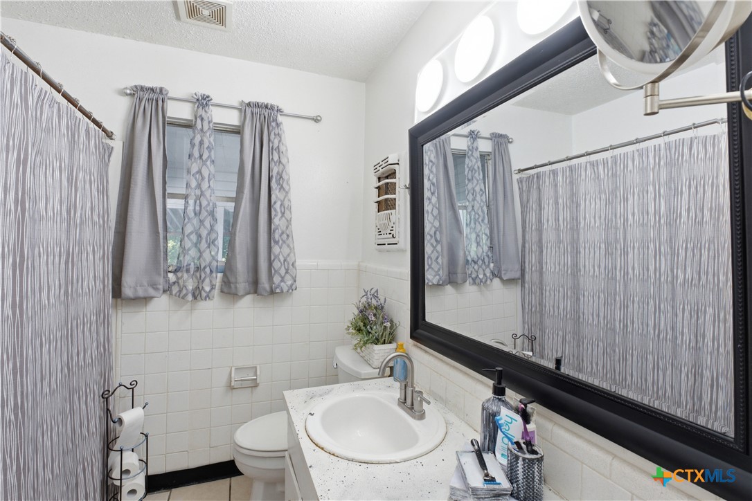 503 Cardinal Avenue Killeen, TX 76541 - Photo 17 of 26 a bathroom with a sink a toilet and shower