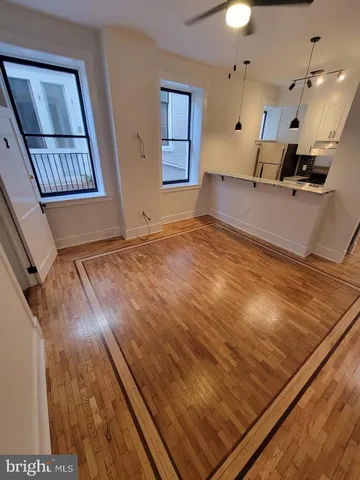 a view of an empty room and a window