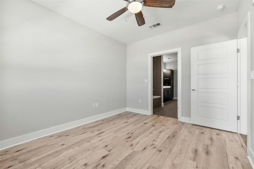 3114 South Congress Avenue, Unit 302 Austin, TX 78704 - Photo 18 of 28 wooden floor in an empty room