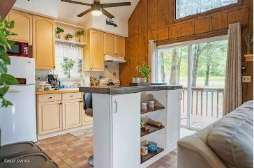 58 Rockway Road Lake Ariel, PA 18436 - Photo 6 of 33 a kitchen with stainless steel appliances kitchen island granite countertop a refrigerator and a sink