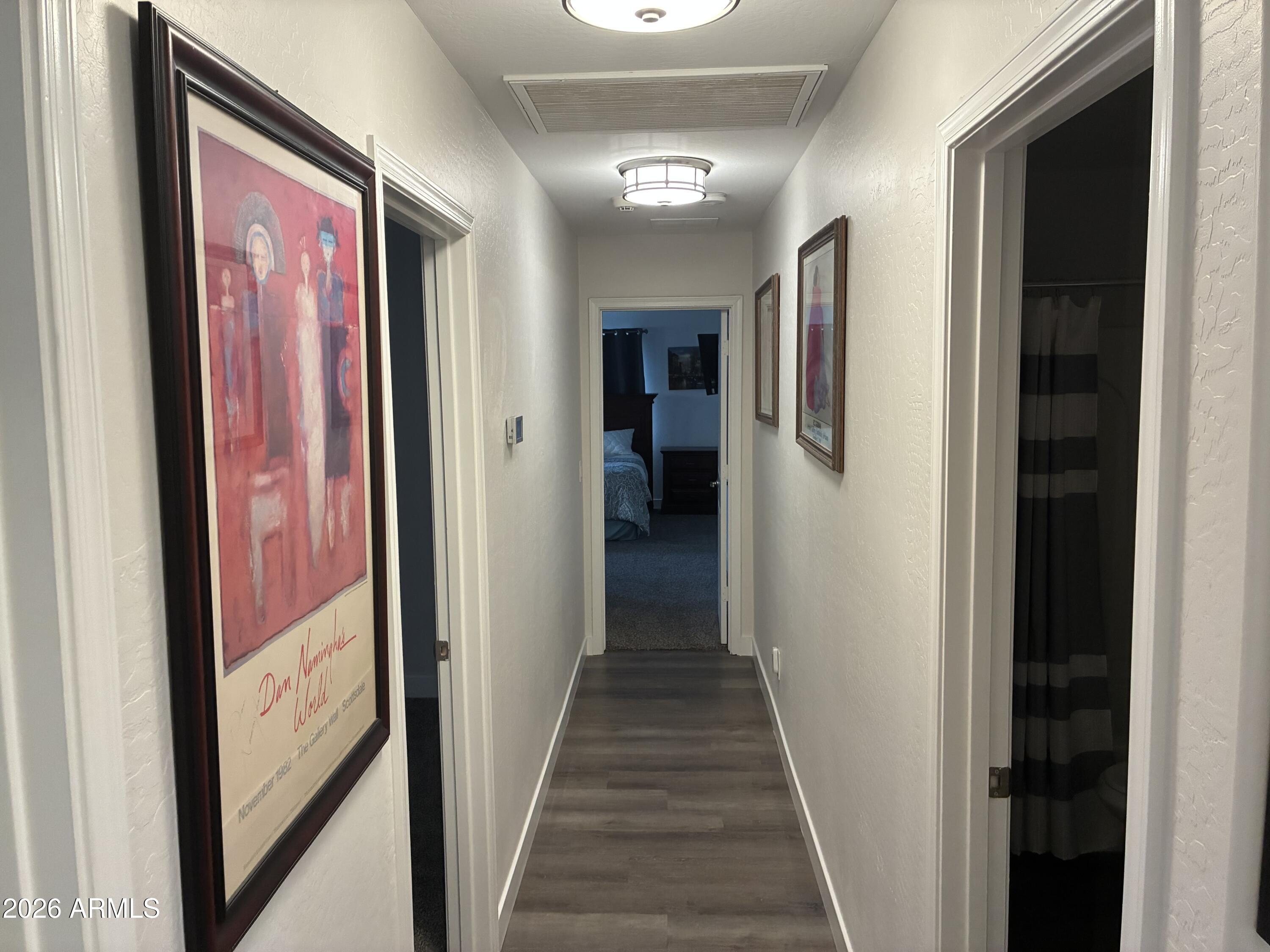4634 West Fremont Rd. Laveen, AZ 85339 - Photo 14 of 46 a view of a hallway with wooden floor and windows