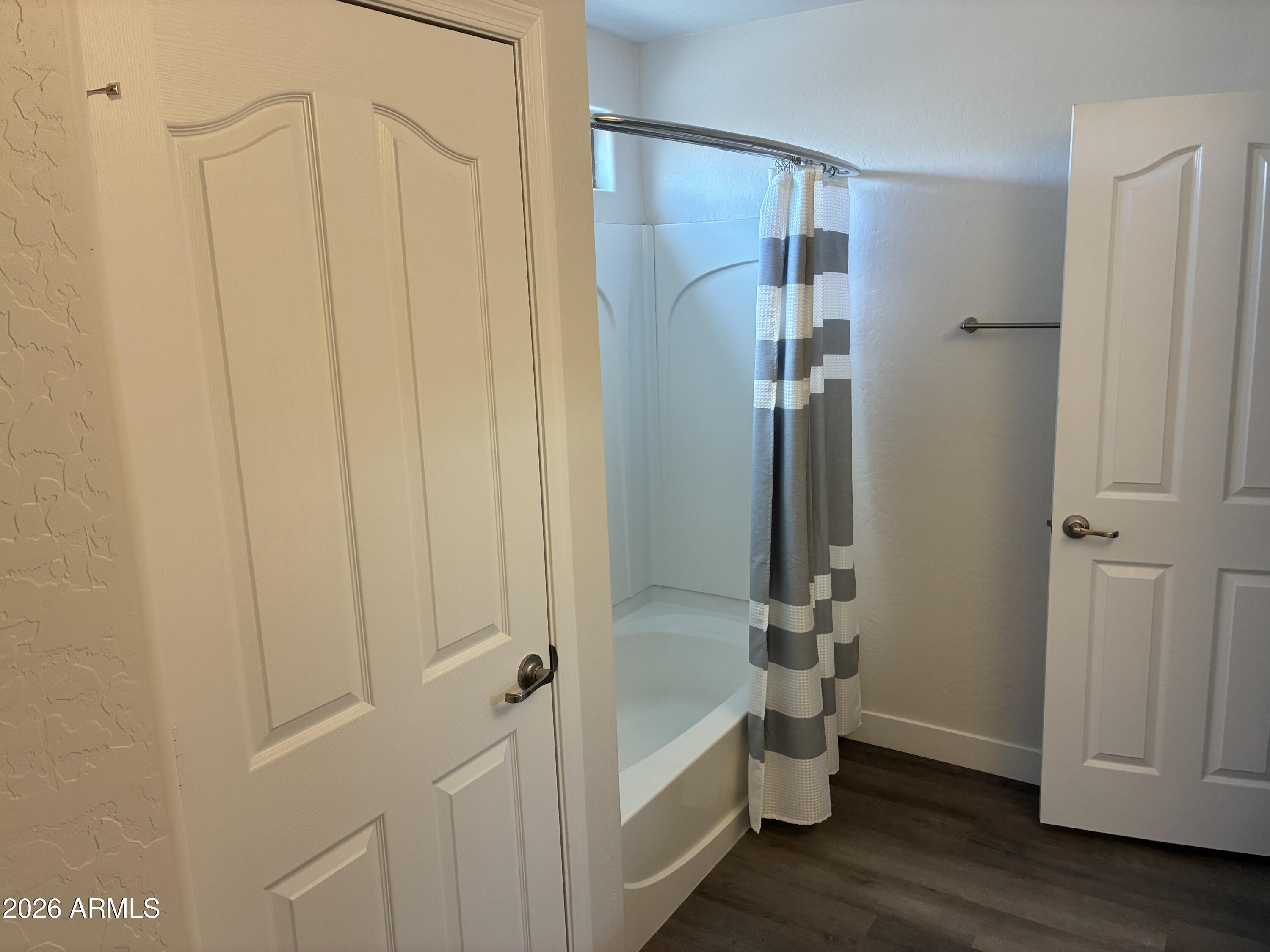 4634 West Fremont Rd. Laveen, AZ 85339 - Photo 26 of 46 a bathroom with a shower and a tub