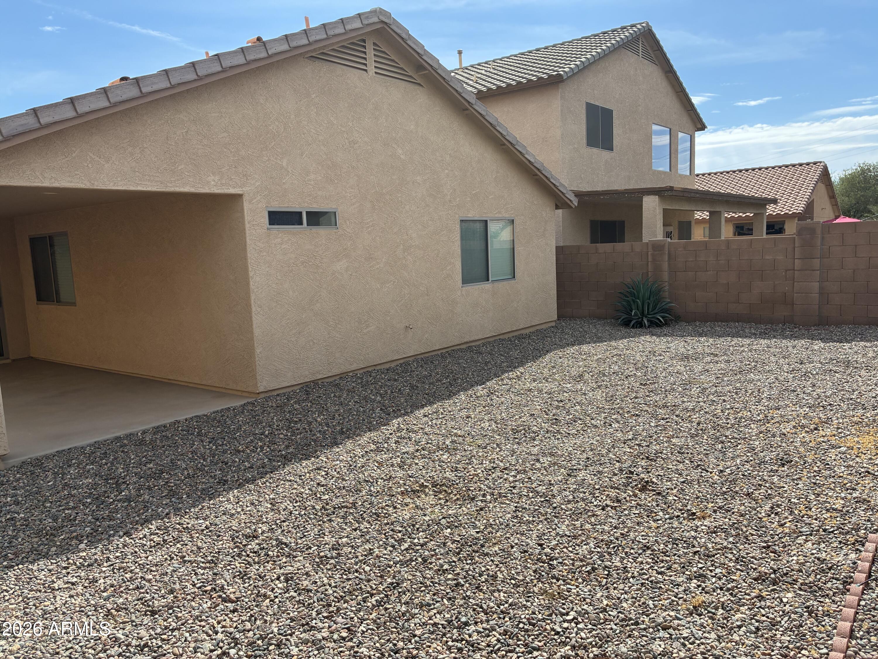 4634 West Fremont Rd. Laveen, AZ 85339 - Photo 37 of 46 a front view of a house with a yard