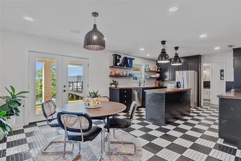 a kitchen with a sink and a microwave