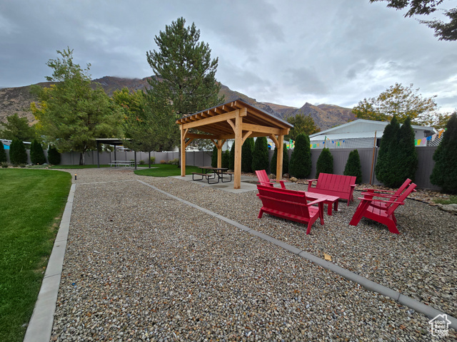 1025 North 300 West, Unit 1 Springville, UT 84663 - Photo 33 of 35 View of home's community with a mountain view, a patio, and a fenced backyard