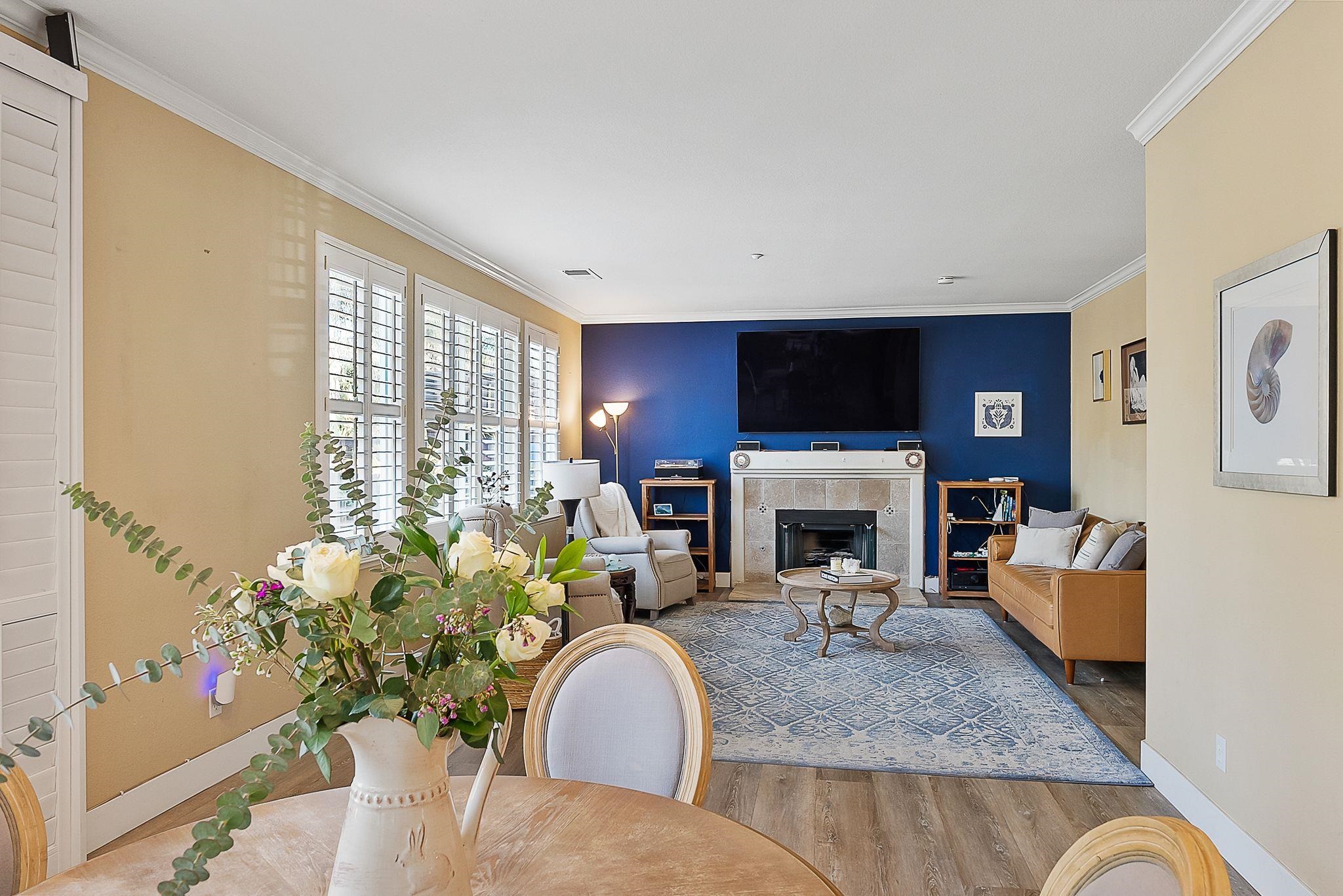 606 Ralston Court Brentwood, CA 94513 - Photo 12 of 32 Living area with wood finished floors, crown molding, and a premium fireplace