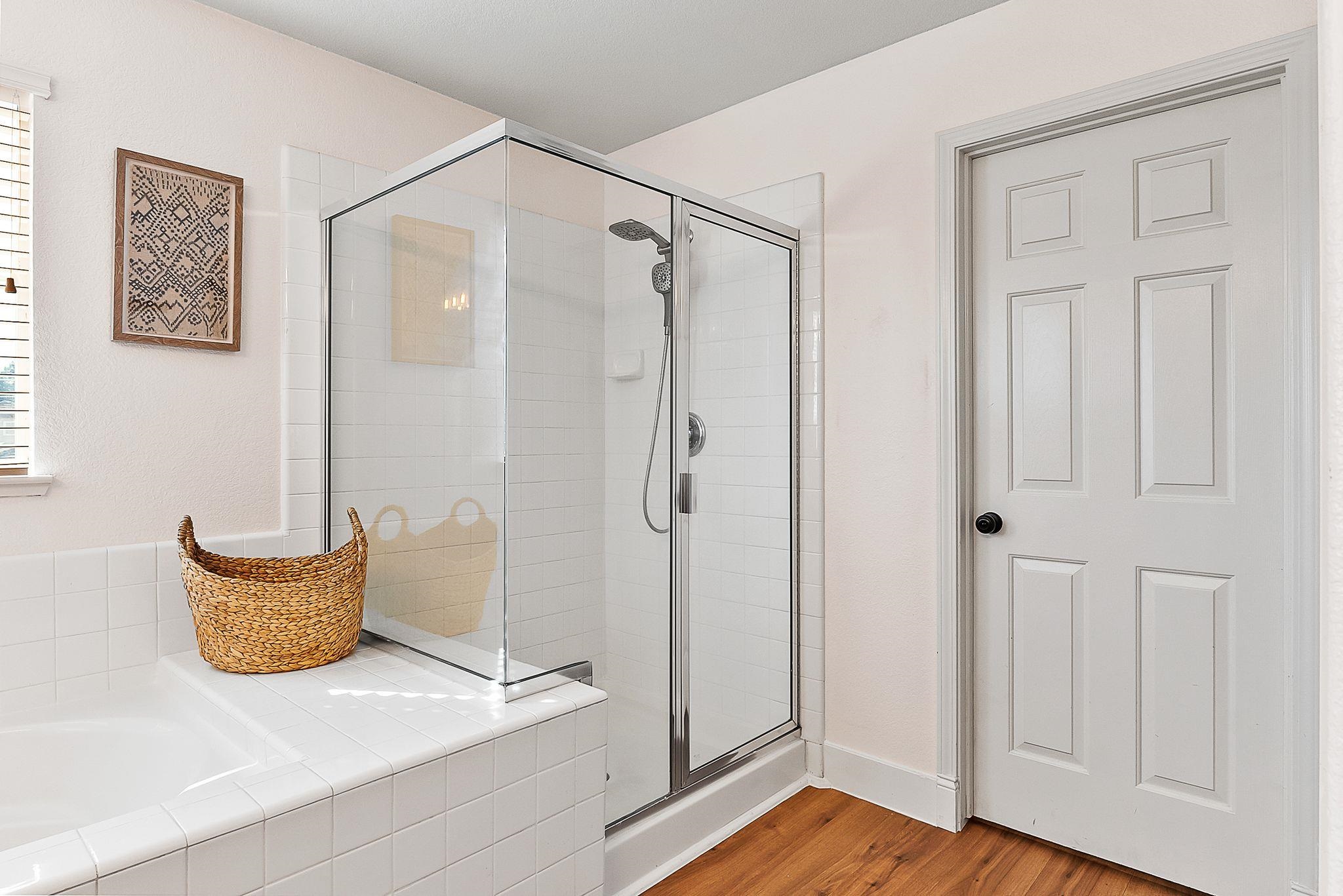 606 Ralston Court Brentwood, CA 94513 - Photo 21 of 32 Full bathroom with a bath, a stall shower, and light wood finished floors