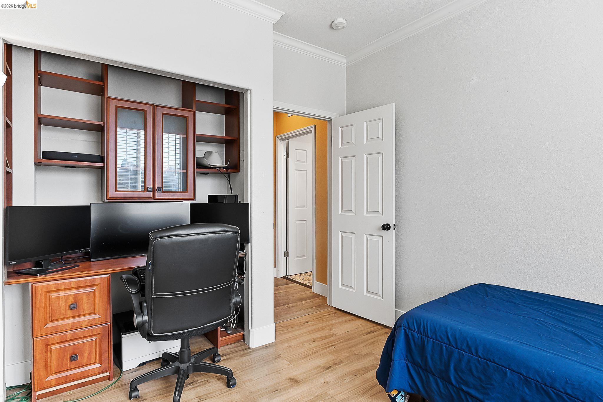 606 Ralston Court Brentwood, CA 94513 - Photo 24 of 32 a workspace with furniture and wooden floor