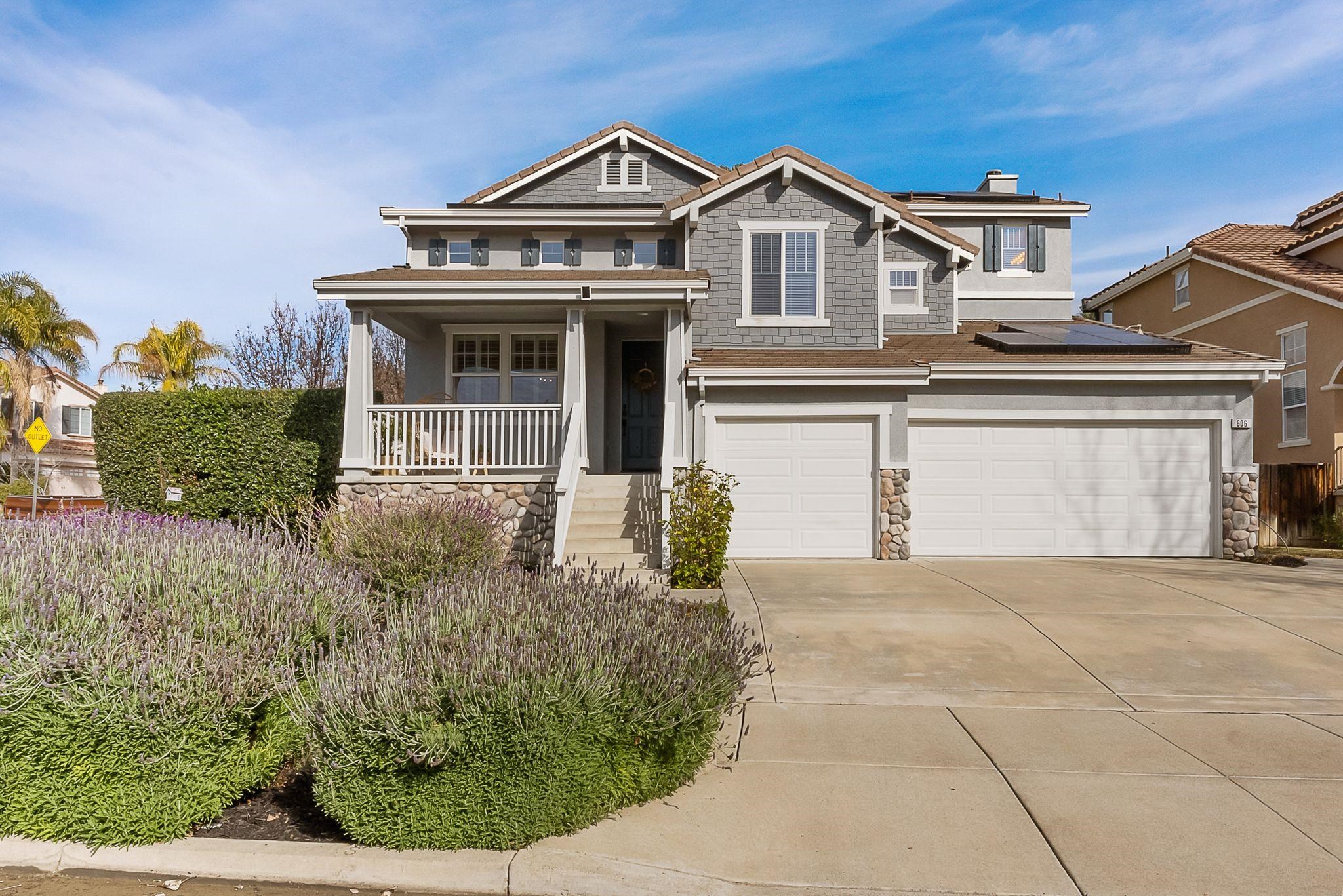 606 Ralston Court Brentwood, CA 94513 - Photo 3 of 32 Craftsman house featuring stone siding, an attached garage, a porch, and a chimney