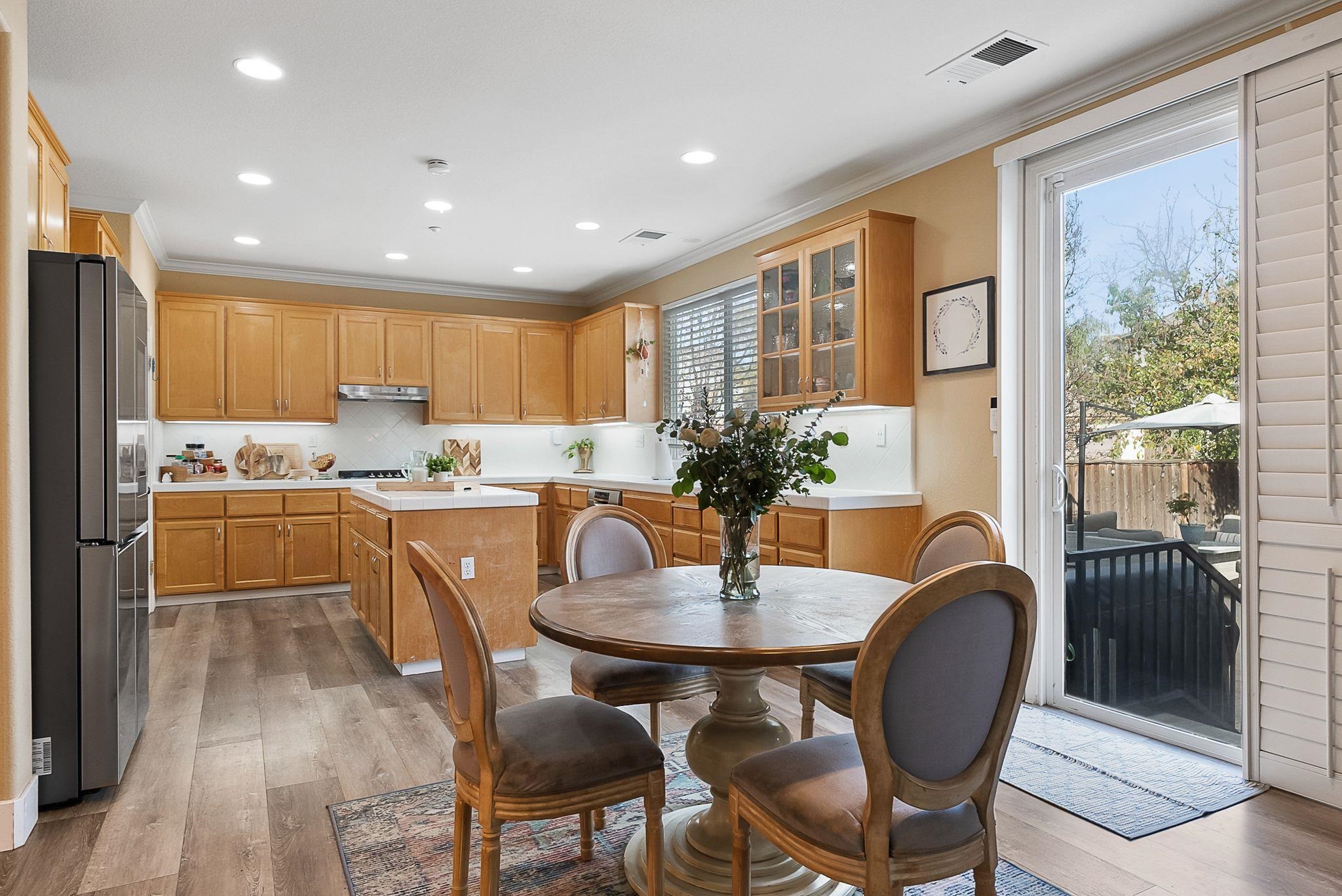 606 Ralston Court Brentwood, CA 94513 - Photo 9 of 32 Dining space featuring light wood-style flooring, ornamental molding, and recessed lighting