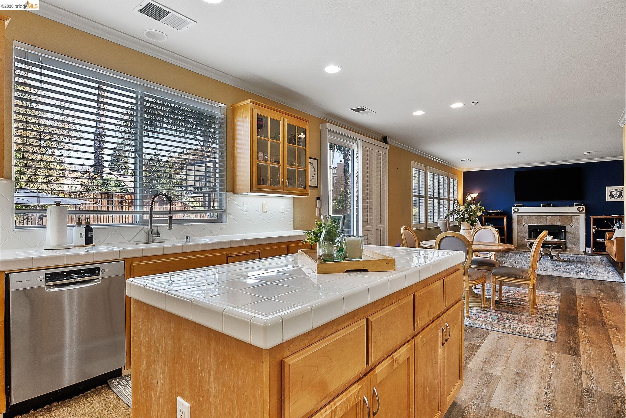 606 Ralston Court Brentwood, CA 94513 - Photo 10 of 32 a view of a kitchen with kitchen island a sink a counter top space and living room filled with furniture