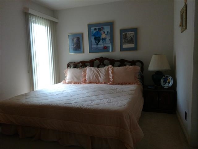 702 Westmore Road Davis, IL 61019 - Photo 9 of 15 a bedroom with a bed and a window