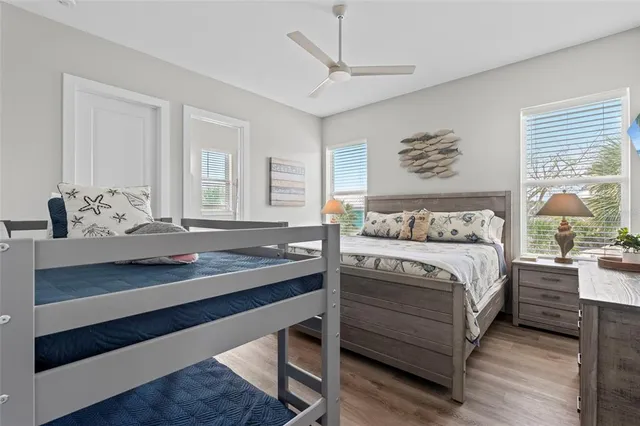 a bathroom with a granite countertop sink a toilet and a mirror