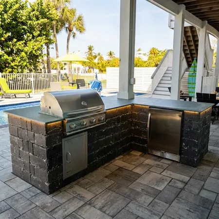 a view of a backyard with swimming pool