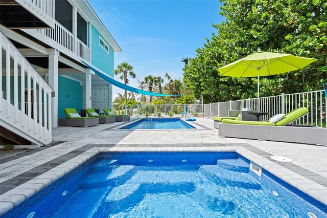 a view of a house with a backyard and a garden