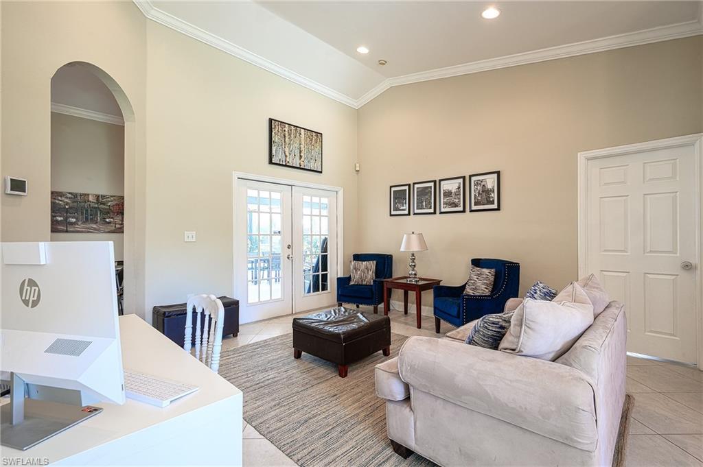 10058 Boca Circle Naples, FL 34109 - Photo 19 of 33 a living room with furniture and wooden floor