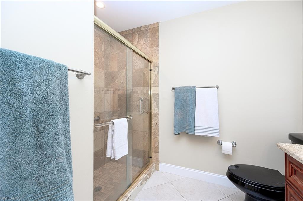 10058 Boca Circle Naples, FL 34109 - Photo 33 of 33 a bathroom with a shower and toilet
