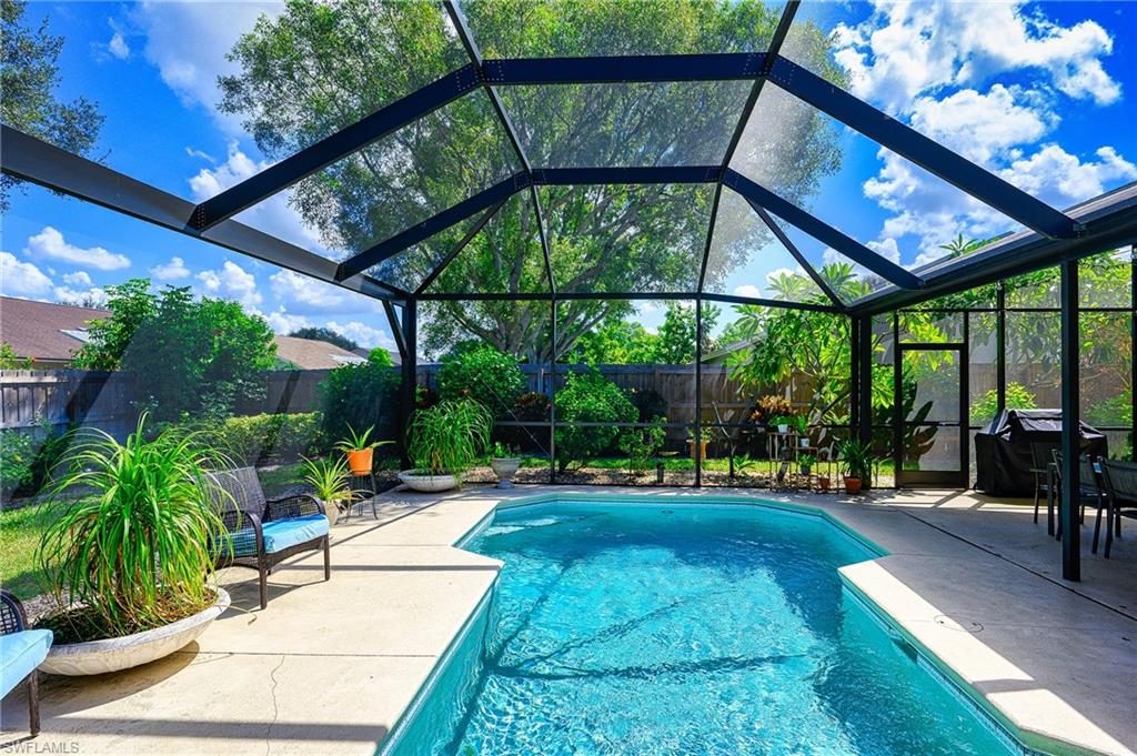 10058 Boca Circle Naples, FL 34109 - Photo 6 of 33 a view of yard with a patio