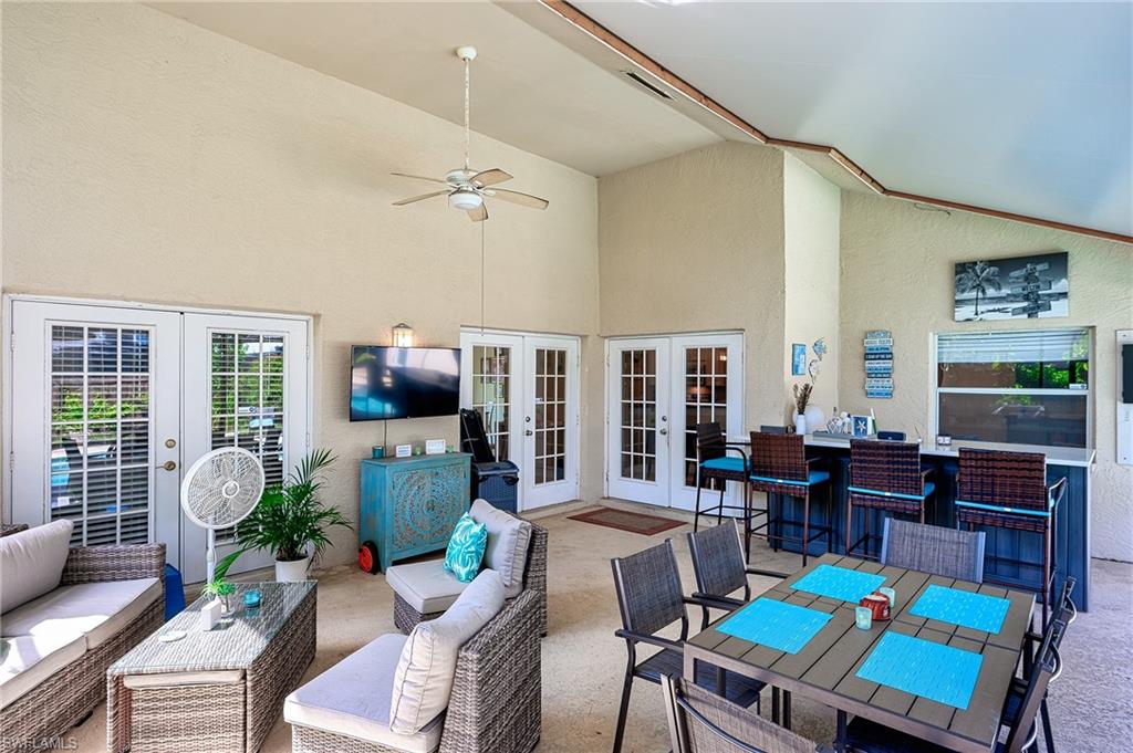 10058 Boca Circle Naples, FL 34109 - Photo 8 of 33 a living room with furniture and wooden floor