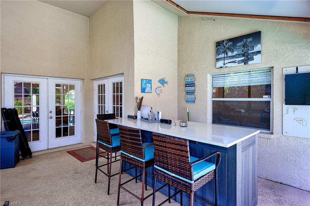 10058 Boca Circle Naples, FL 34109 - Photo 10 of 33 a view of a dining room with furniture